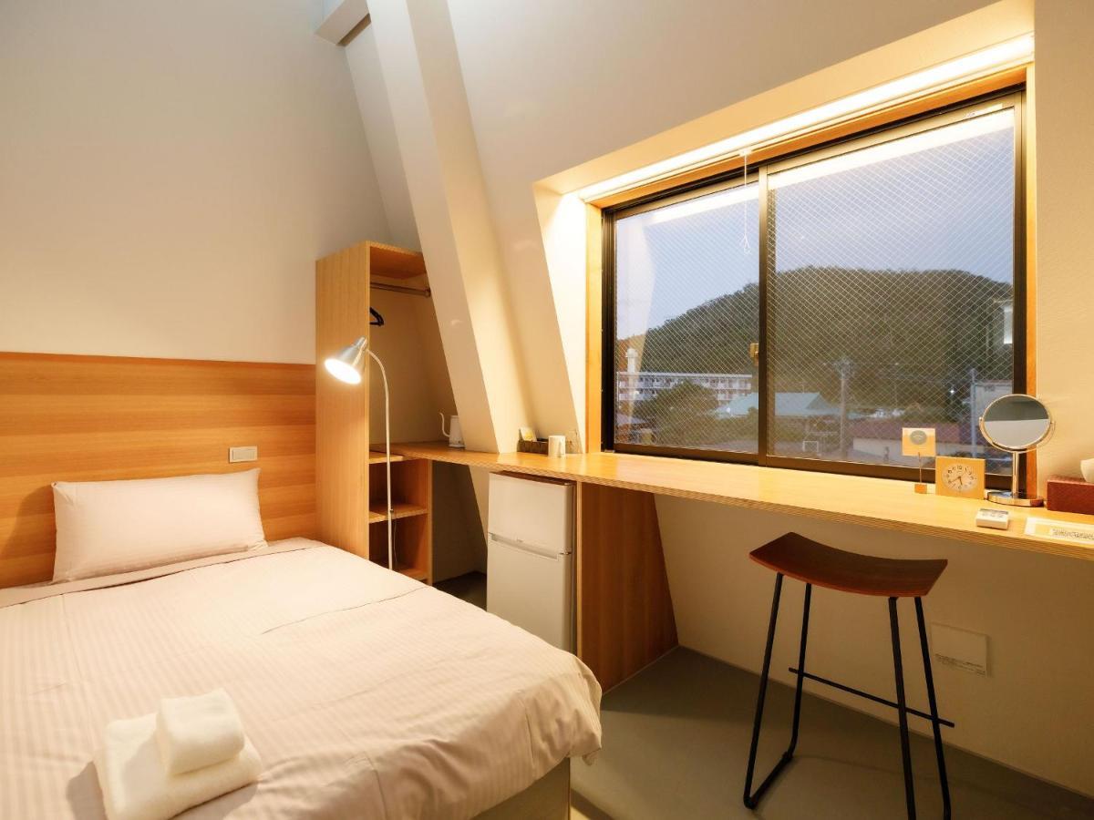Denpaku Akakina Hotel Amami Chambre photo
